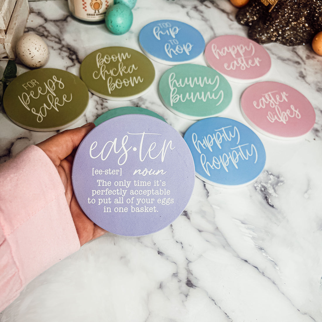 A set of colorful ceramic coasters featuring Easter and spring designs, showcasing a matte finish and cork backing for protection.