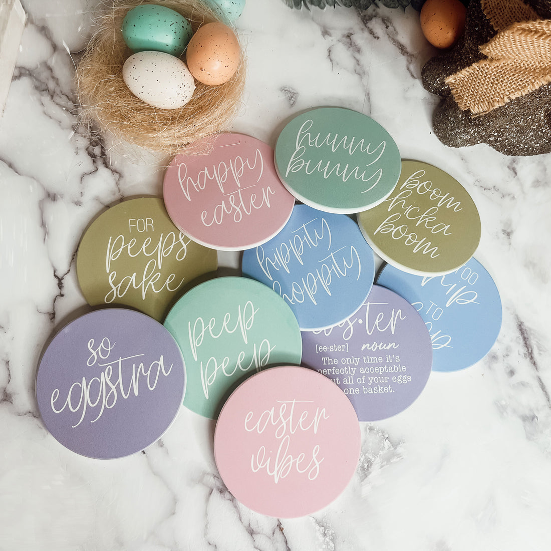 A set of colorful ceramic coasters featuring Easter and spring designs, showcasing a matte finish and cork backing for protection.