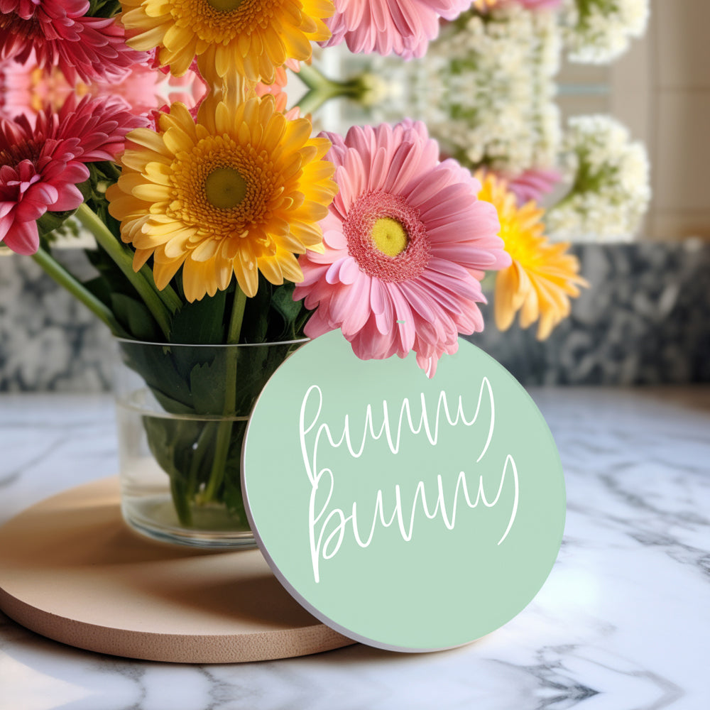 A set of colorful ceramic coasters featuring Easter and spring designs, showcasing a matte finish and cork backing for protection.