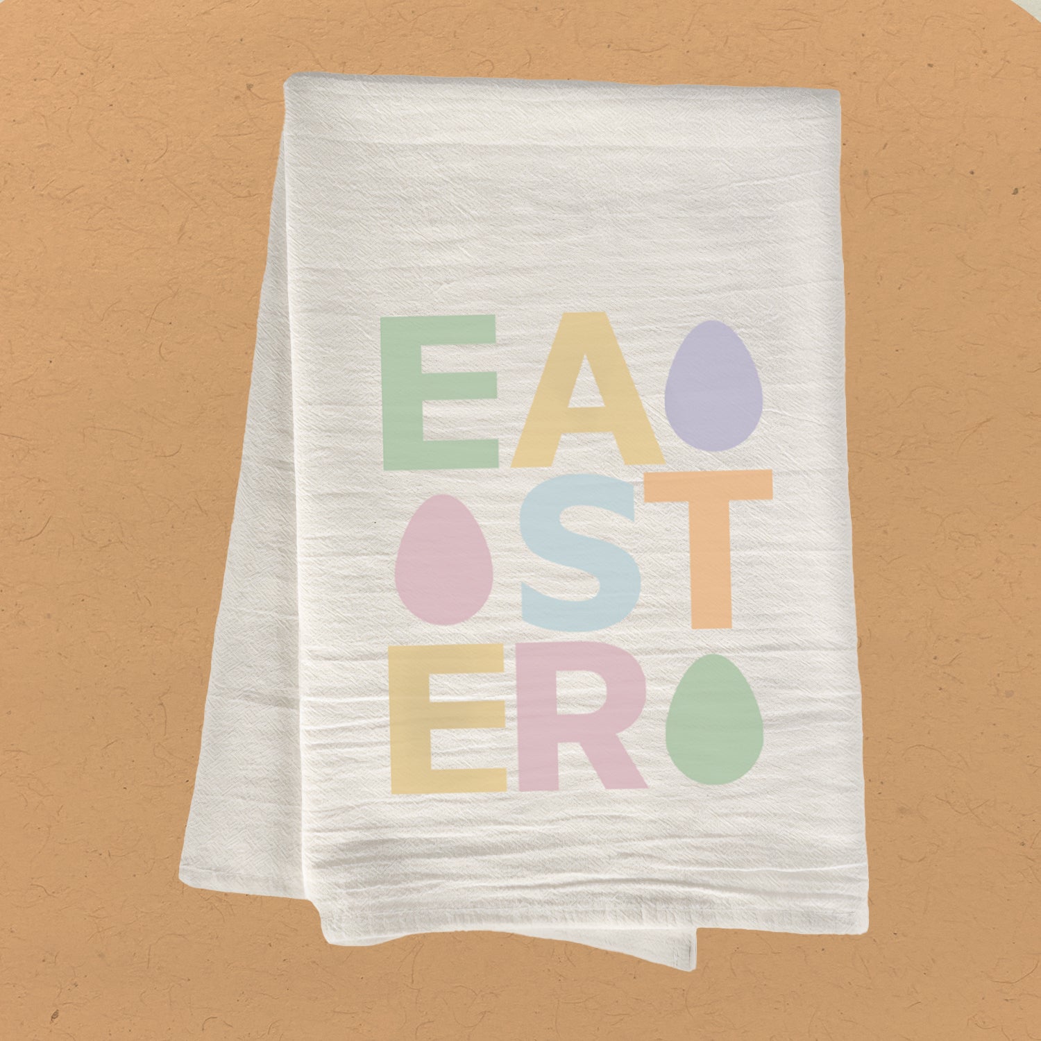 Easter Text Cotton Tea Towel featuring colorful eggs and festive design, made from 100% absorbent cotton, measuring 27 inches square.