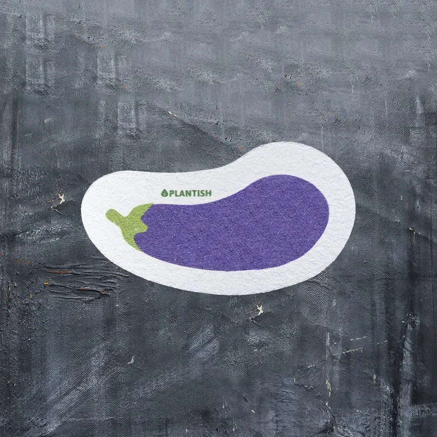 Eggplant Pop-up Sponge made from 100% vegetable cellulose, featuring a vibrant eggplant design, ideal for eco-friendly cleaning.