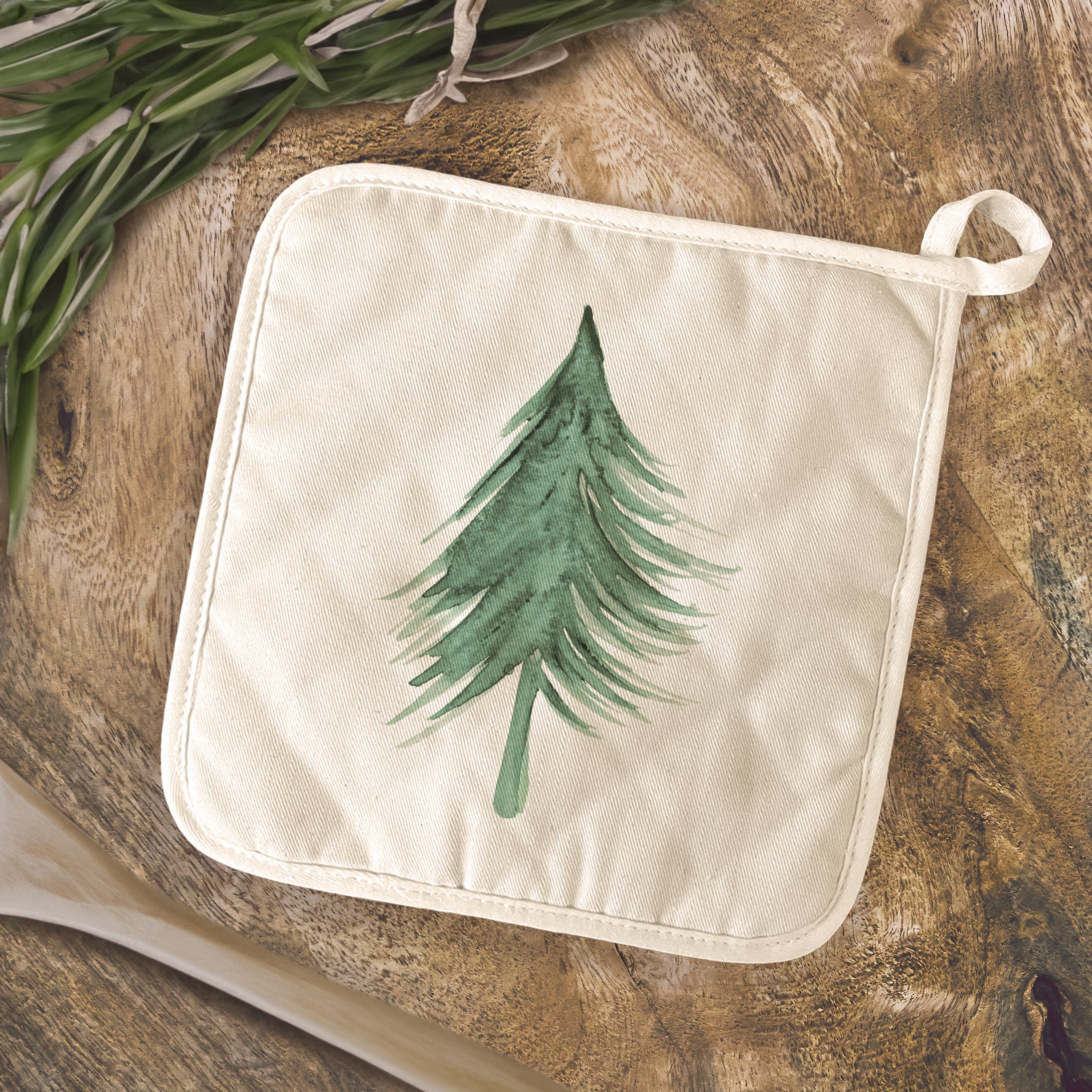 Evergreen Tree Cotton Pot Holder featuring vibrant designs, made from durable cotton and terry cloth, perfect for protecting surfaces from hot cookware.