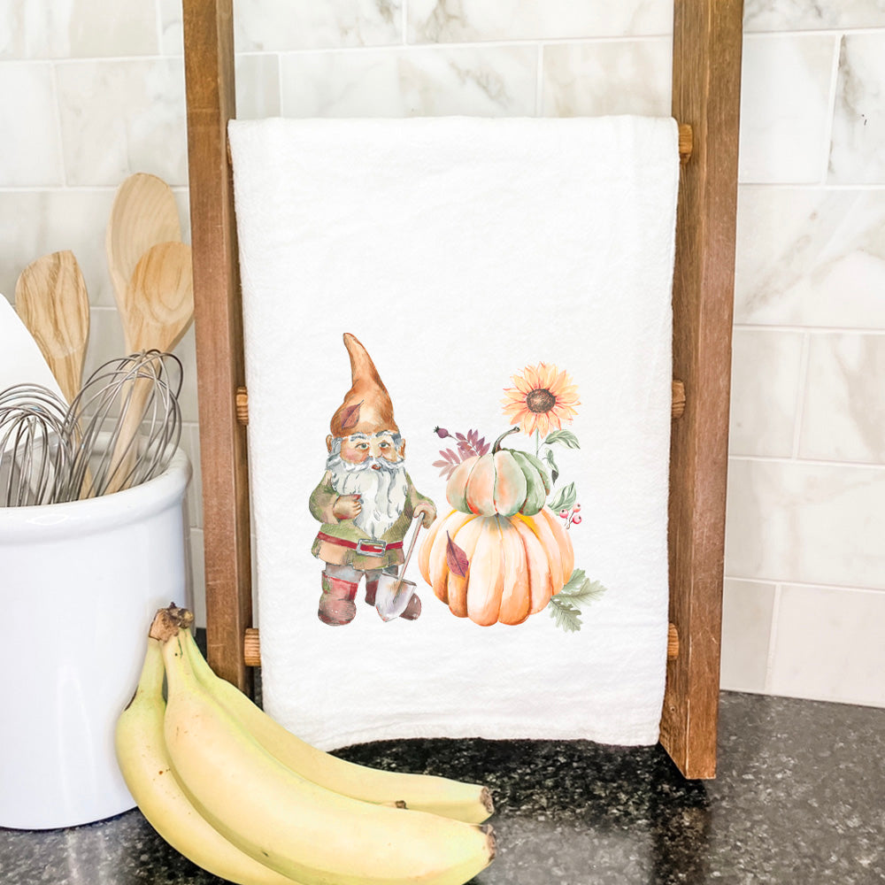 A colorful Fall Garden Gnome cotton tea towel featuring vibrant autumn designs, perfect for kitchen use.