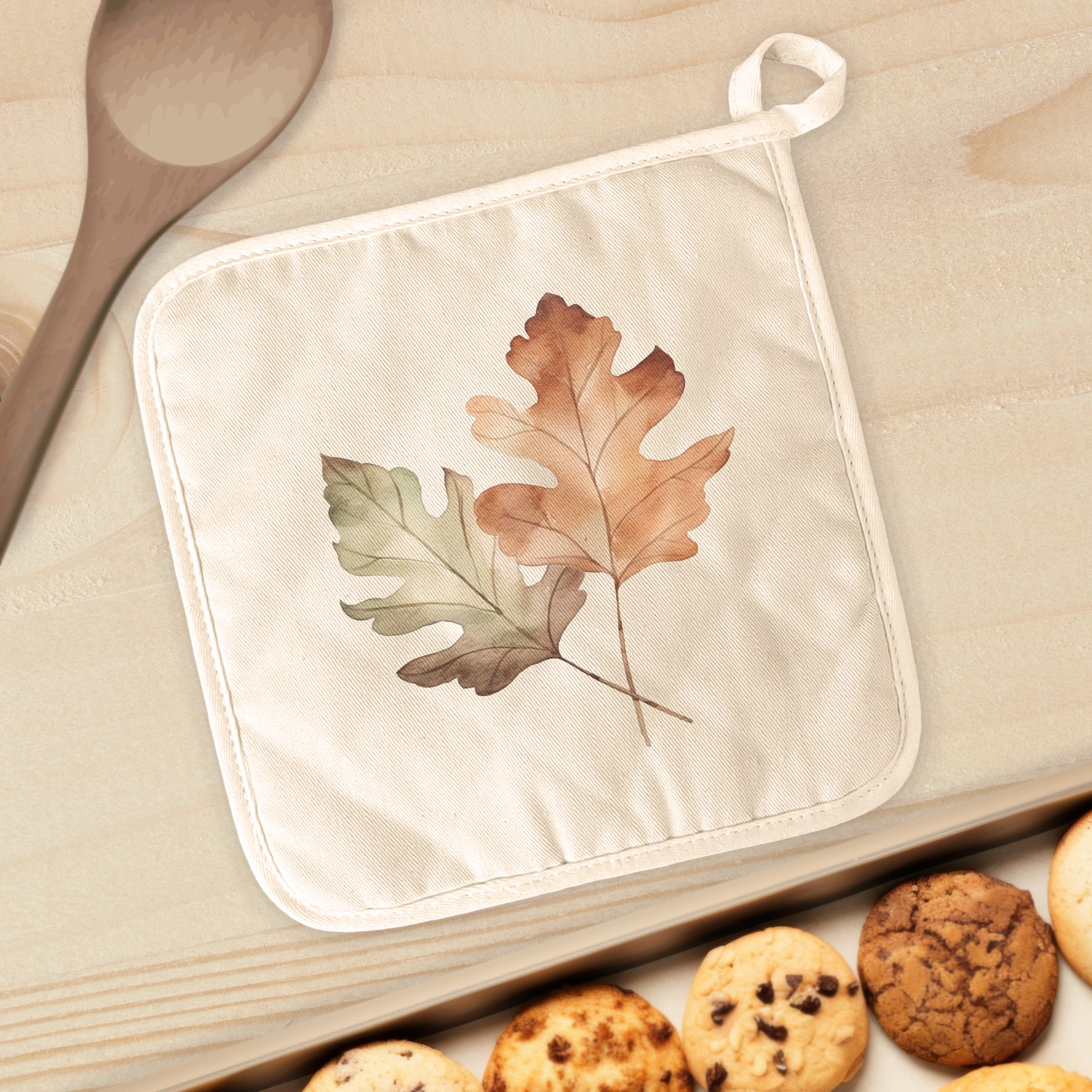 A square cotton pot holder featuring a vibrant Fall Oak Leaves design, perfect for protecting surfaces from hot cookware.