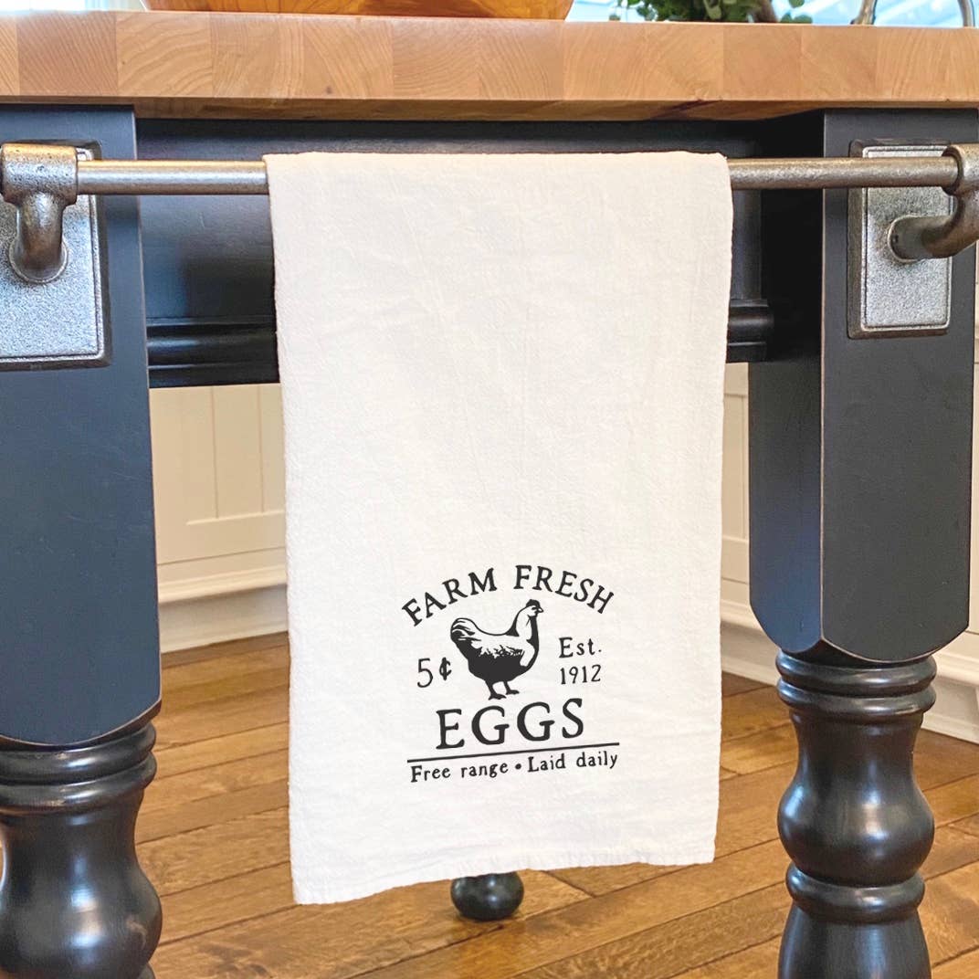 Farm Fresh Eggs cotton tea towel featuring vibrant design and hemmed edges, perfect for kitchen use.