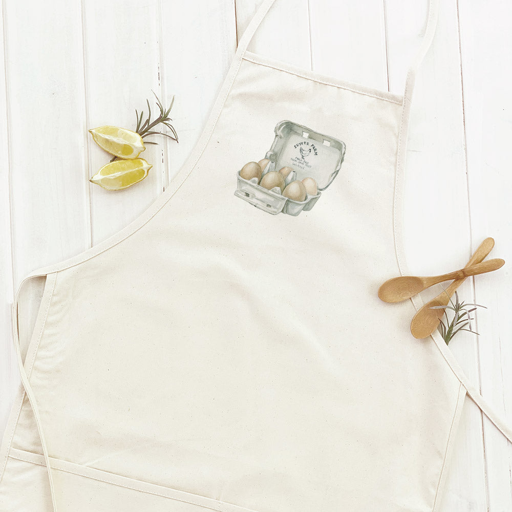 Farm Fresh Eggs Women's Apron made of cotton canvas with natural twill ties and a divided front pocket, featuring eco-friendly printed design.