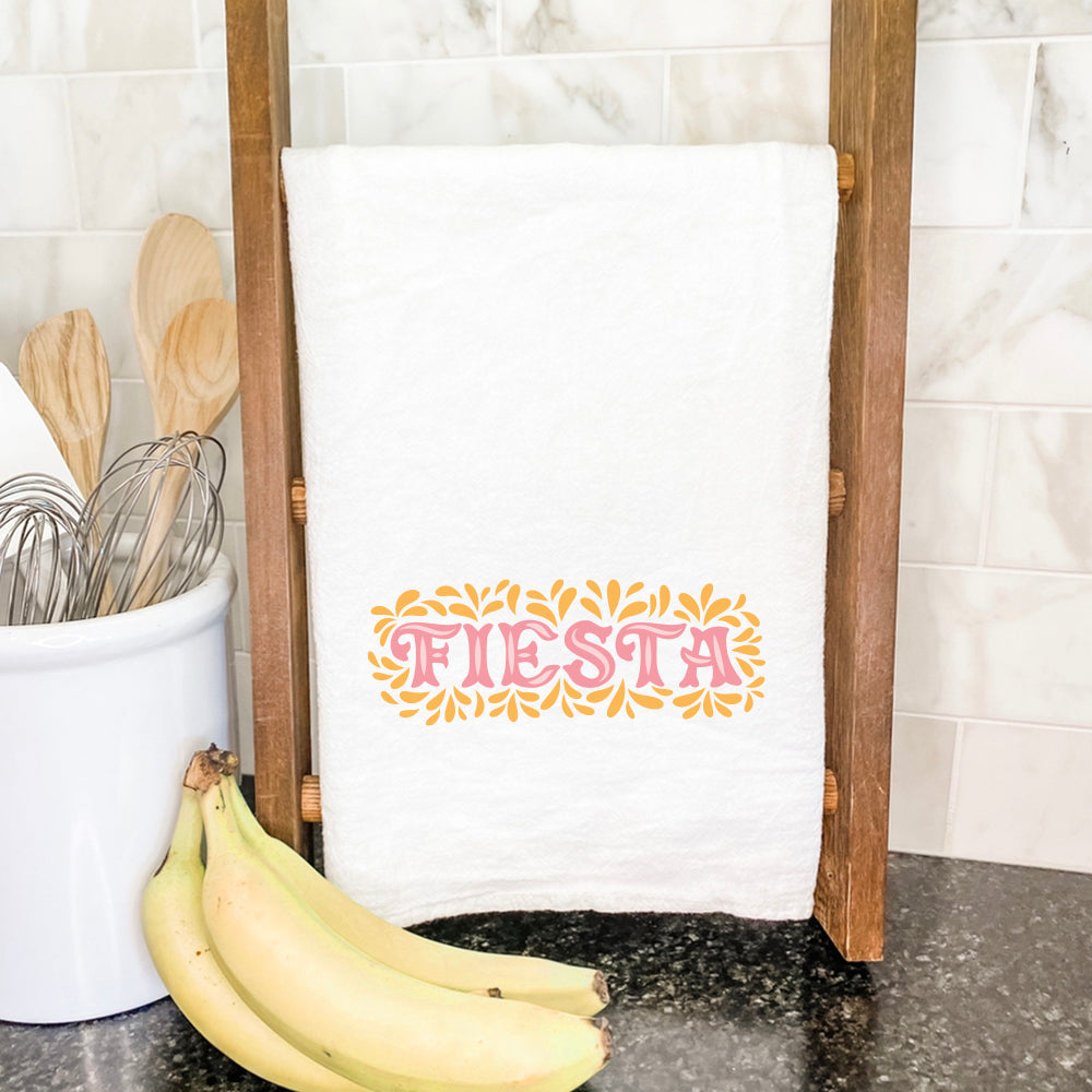 Fiesta Cotton Tea Towel featuring vibrant designs and hemmed edges, perfect for kitchen use.