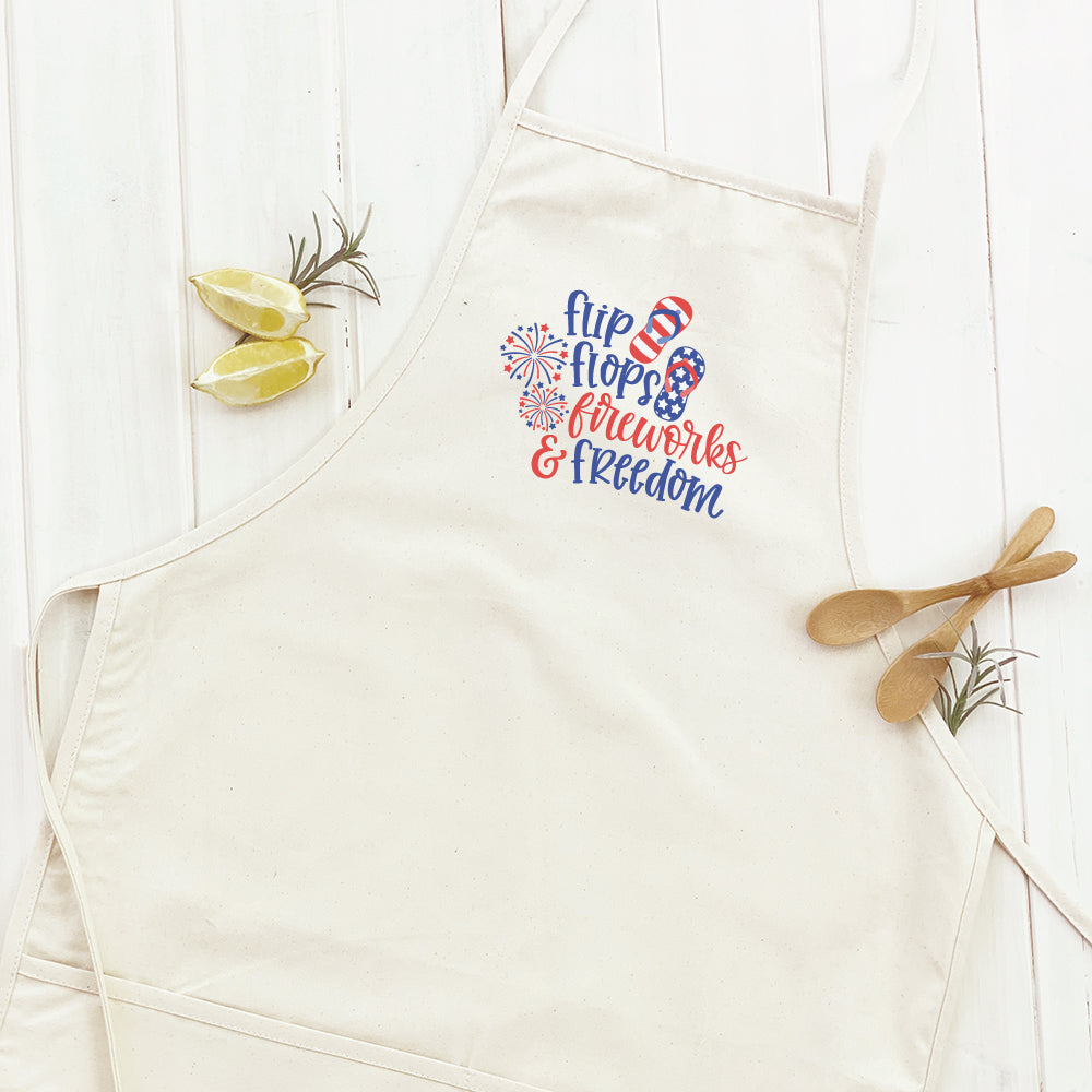 Women's apron featuring a vibrant fireworks design, made from durable cotton canvas with adjustable neck and twill ties.