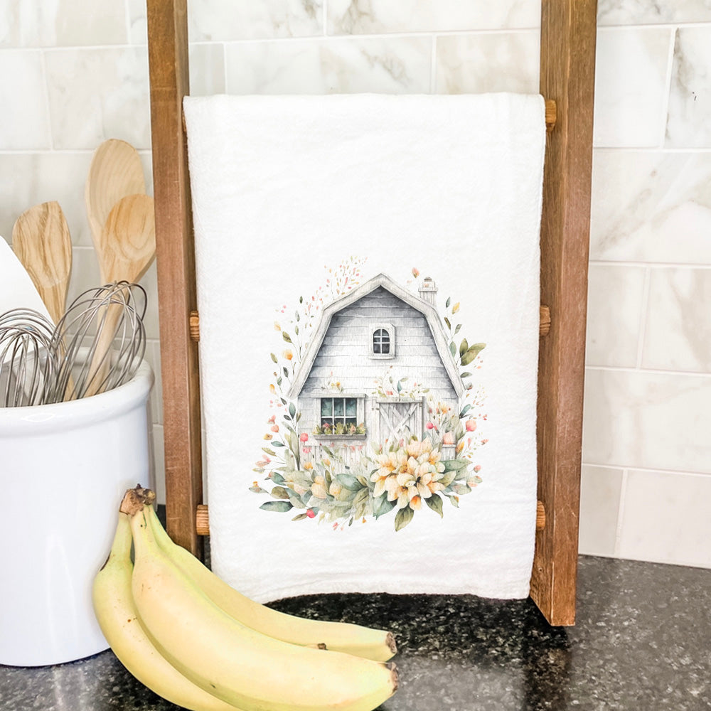 Floral Barn Cotton Tea Towel featuring a vibrant floral design, made from 100% absorbent cotton, displayed on a kitchen countertop.