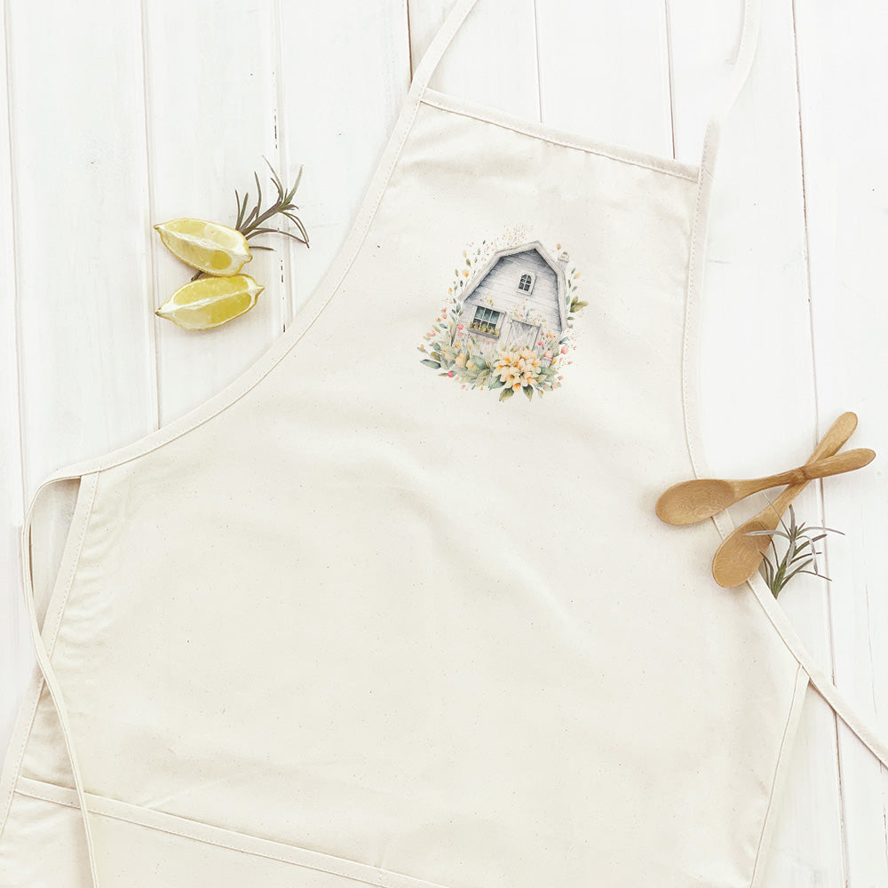 Floral Barn Women's Apron featuring elegant floral design, adjustable neck, and divided front pocket.