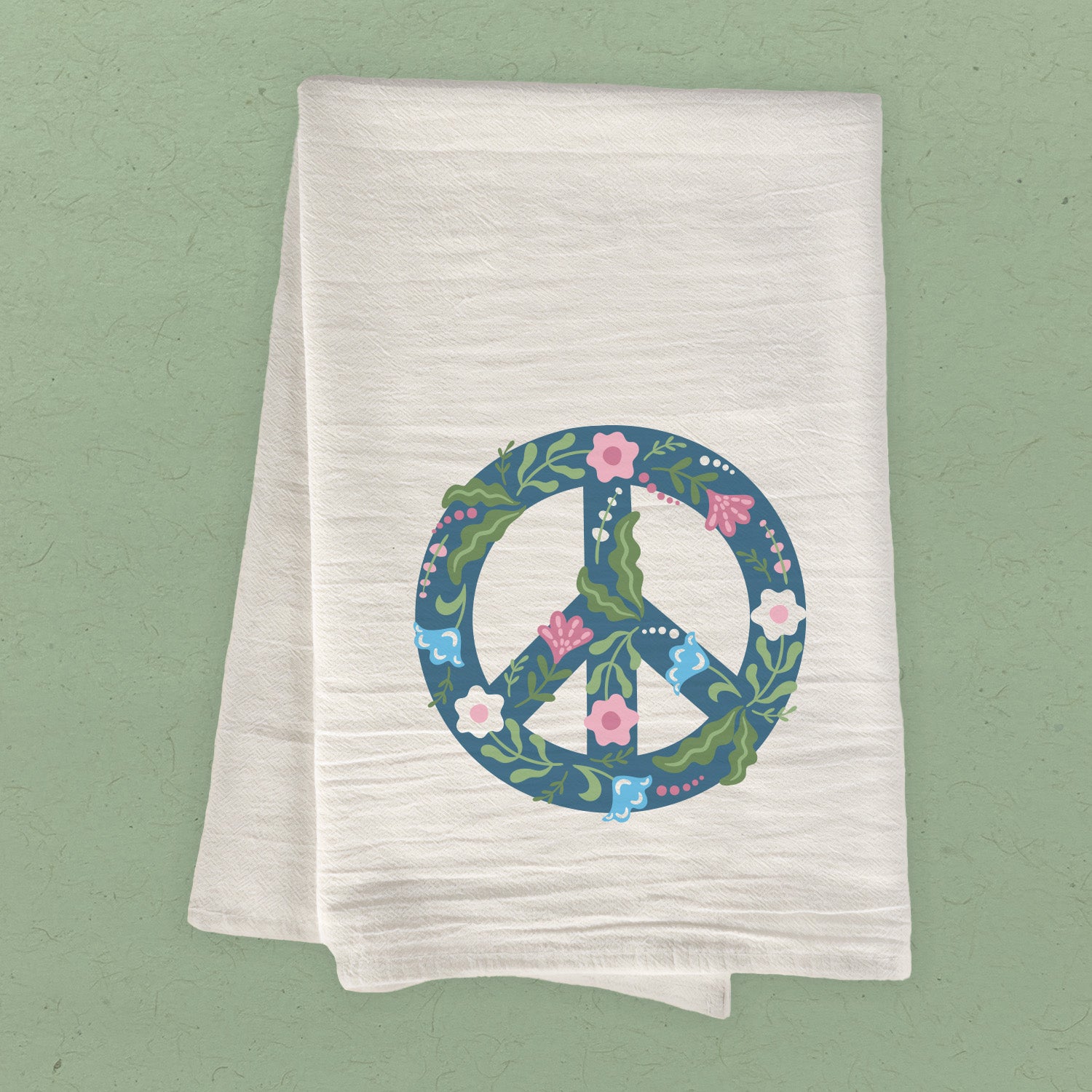 A colorful cotton tea towel featuring a floral peace sign design, perfect for kitchen use.