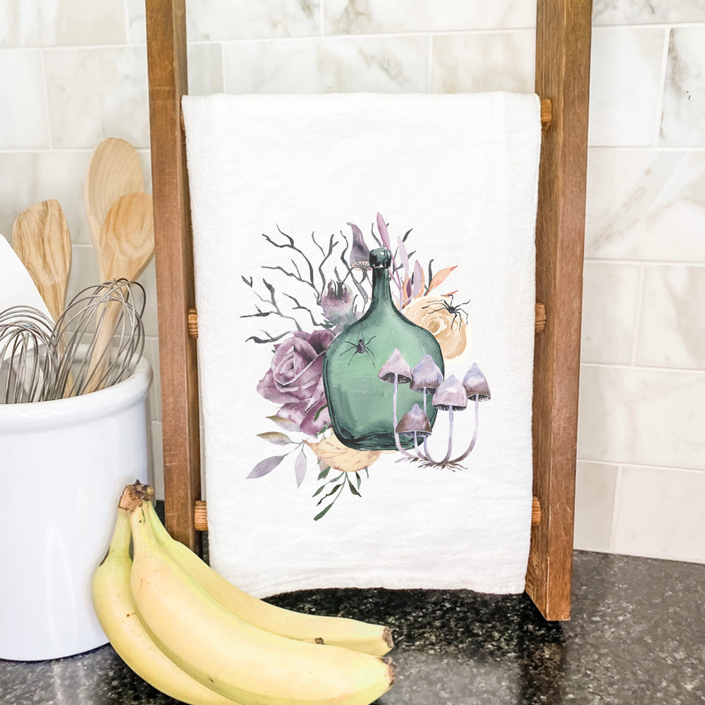 Floral Potion Cotton Tea Towel featuring vibrant floral design, hemmed edges, and absorbent fabric, perfect for kitchen use.