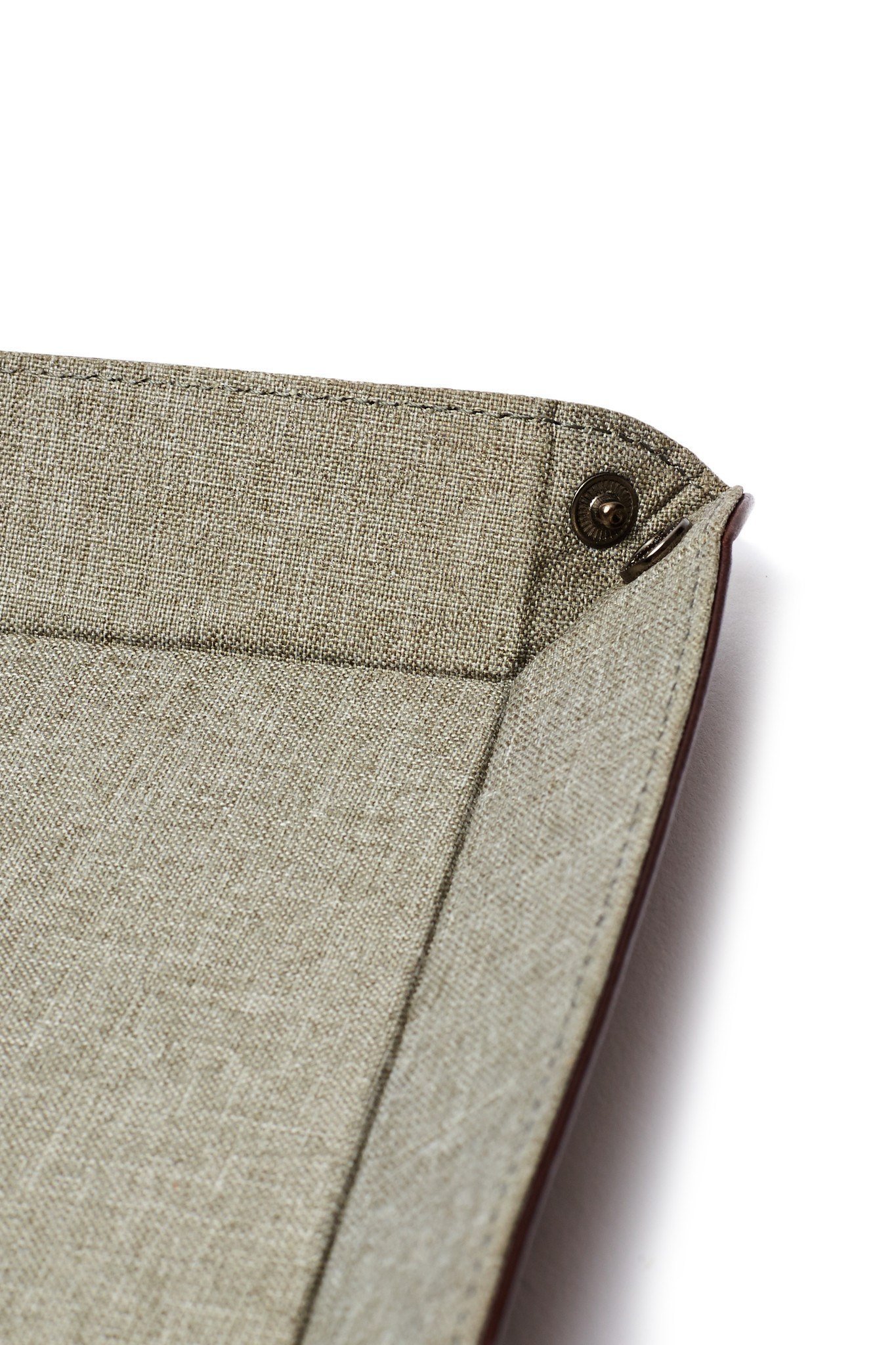 Corner of folded fabric tray.