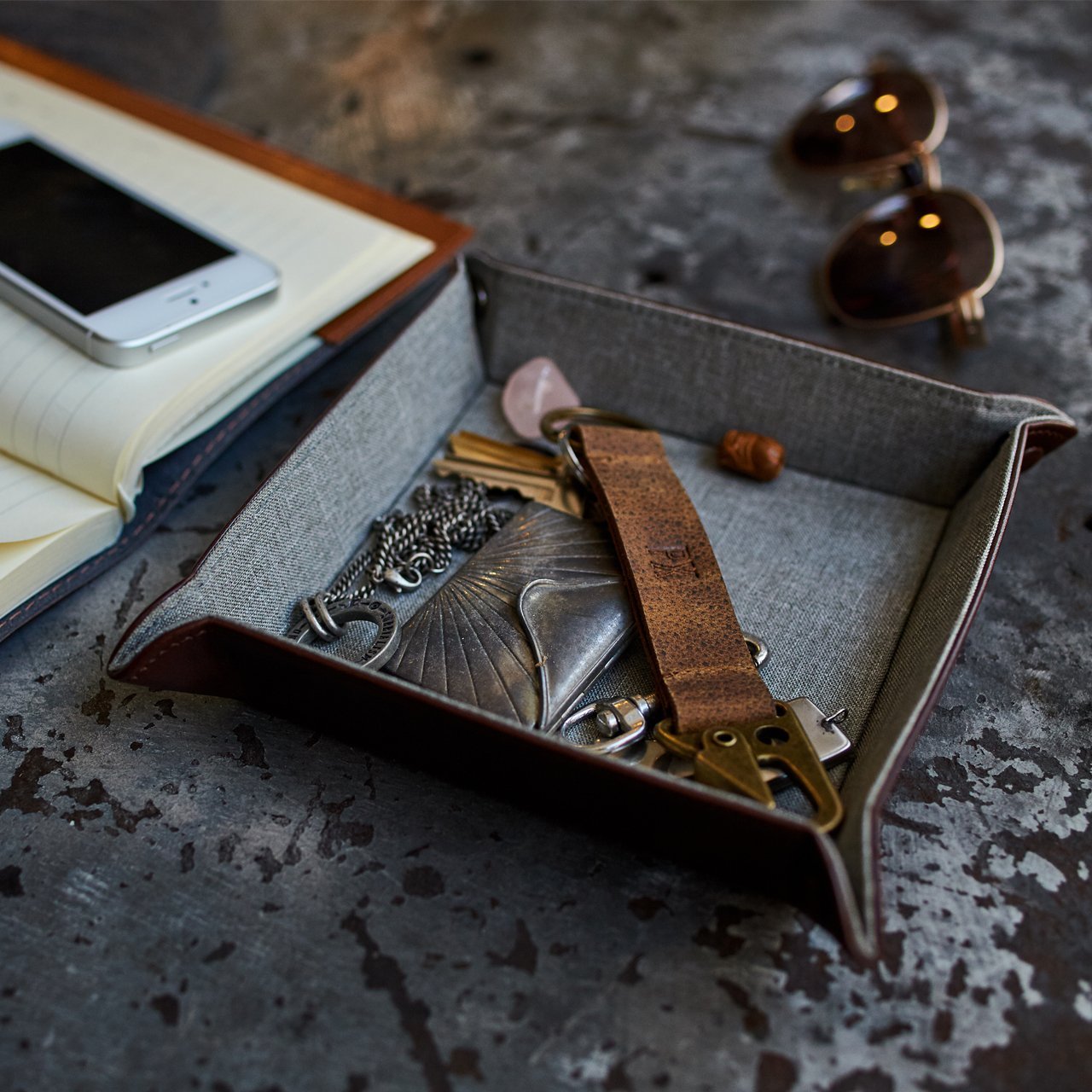 Valet tray with miscellaneous items.