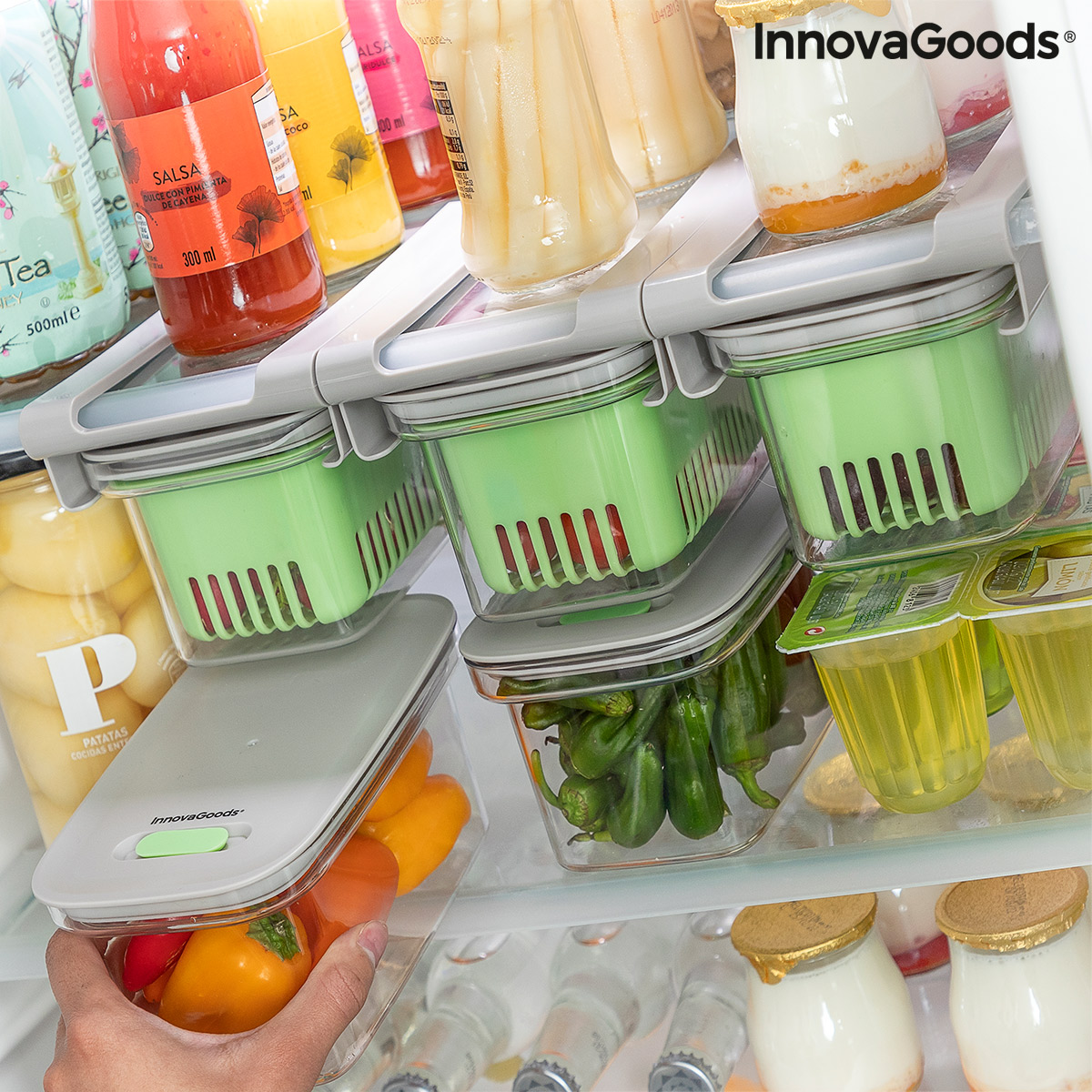 Organized fridge with storage boxes.