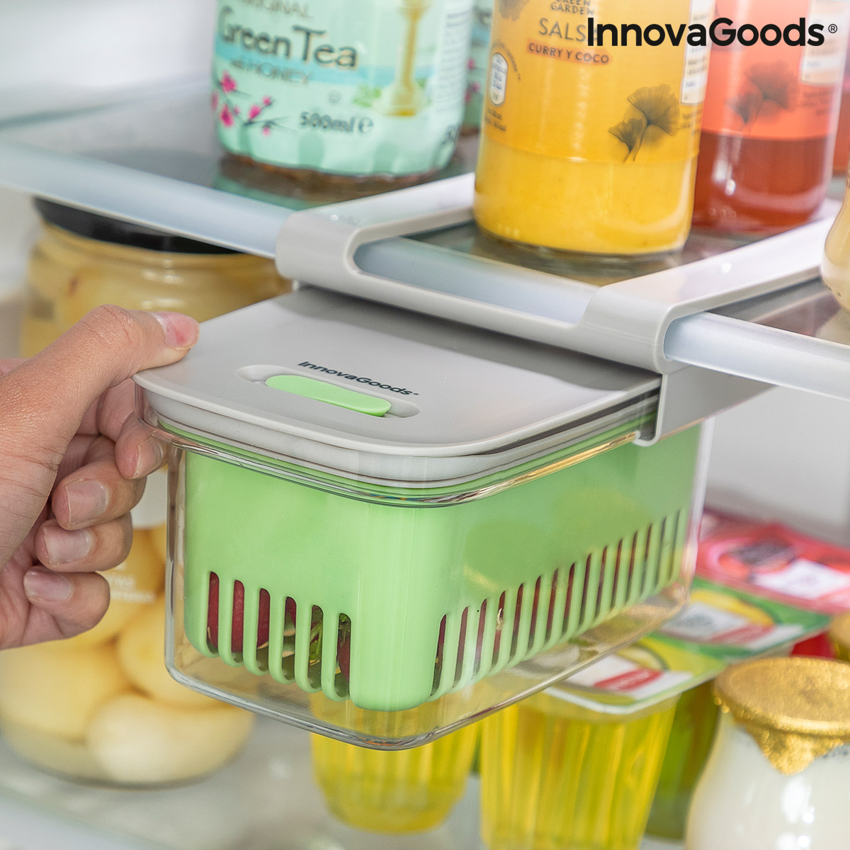 Hand pulls container in fridge.