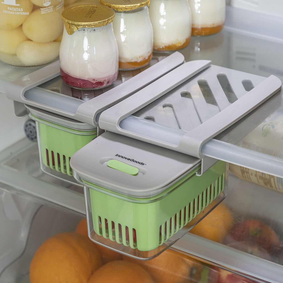 Refrigerator with sliding storage containers.