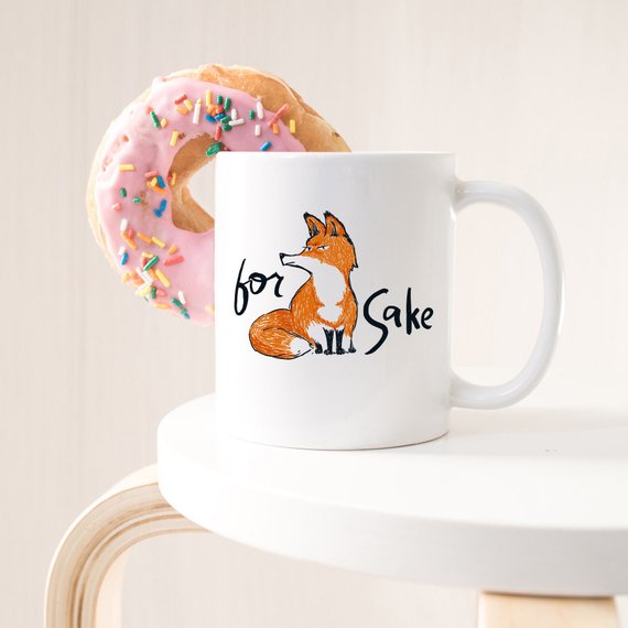 For Fox Sake ceramic coffee mug featuring a humorous design with vibrant colors, perfect for coffee lovers and as a gift.