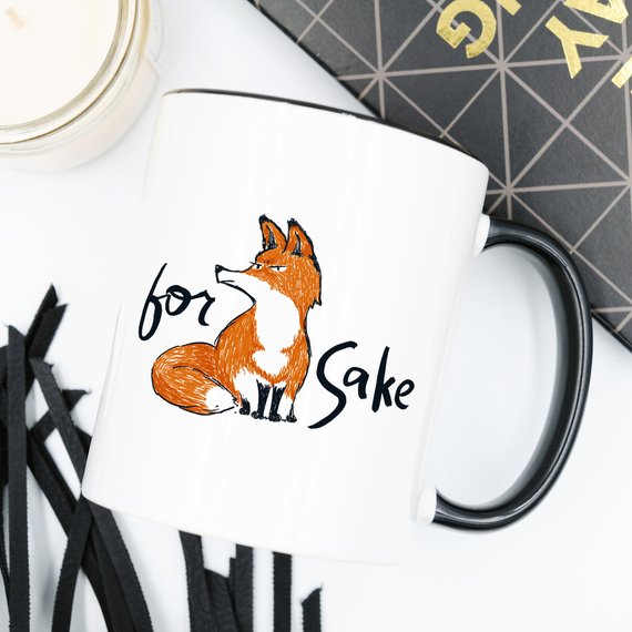 For Fox Sake ceramic coffee mug featuring a humorous design with vibrant colors, perfect for coffee lovers and as a gift.