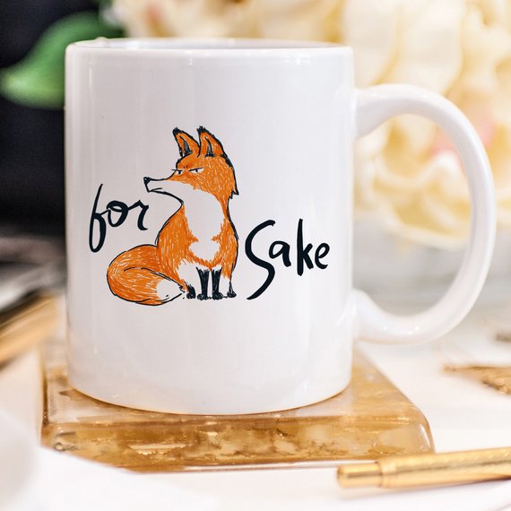 For Fox Sake ceramic coffee mug featuring a humorous design with vibrant colors, perfect for coffee lovers and as a gift.