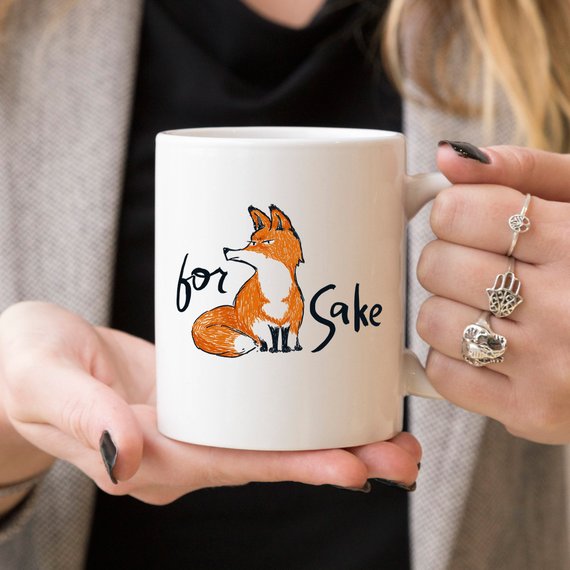 For Fox Sake ceramic coffee mug featuring a humorous design with vibrant colors, perfect for coffee lovers and as a gift.