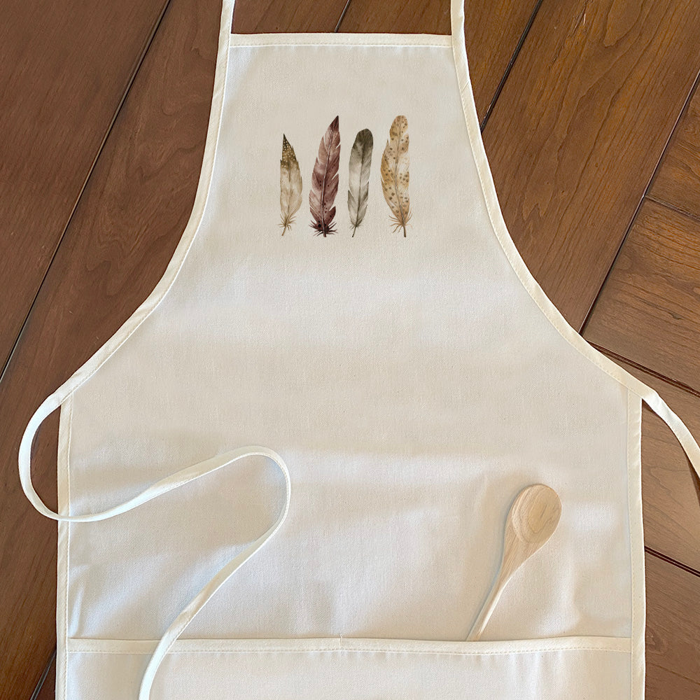 Four Feathers Women's Apron made of cotton canvas with natural twill ties, featuring a divided front pocket and eco-friendly printed design.