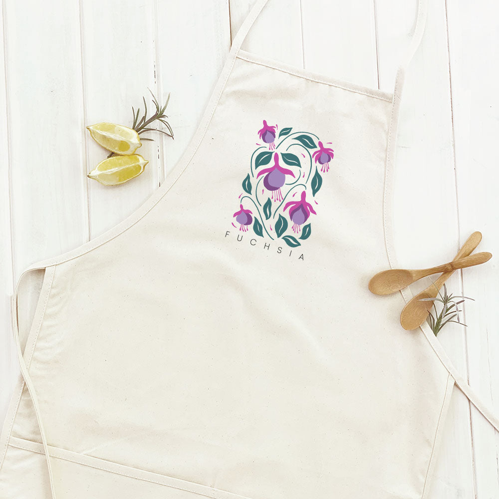 Fuchsia Women's Apron featuring elegant design, adjustable neck, and divided front pocket, made from durable cotton canvas.