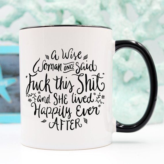 A high-quality ceramic coffee mug featuring a humorous quote that reads 'A Wise Woman Once Said 