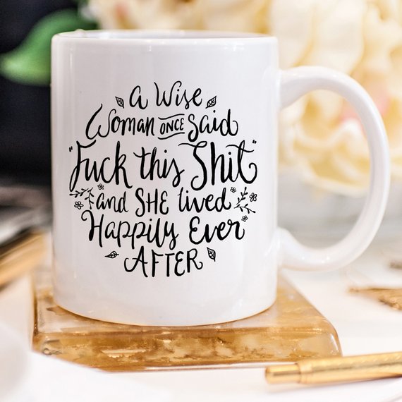 A high-quality ceramic coffee mug featuring a humorous quote that reads 'A Wise Woman Once Said 