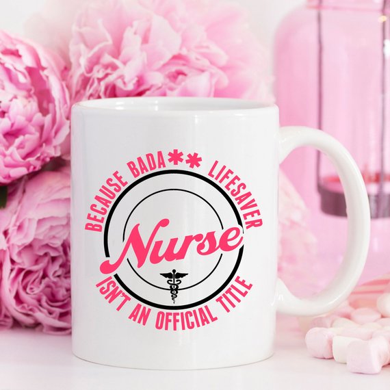 A high-quality white coffee mug featuring the text 'Nurse - Because Bada** Lifesaver Isn't An Official Title' in bold, vivid letters, perfect for nurses.