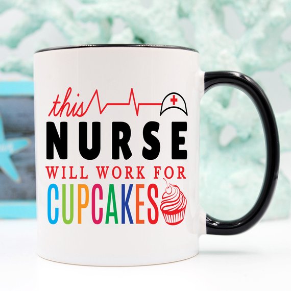 A high-quality ceramic coffee mug featuring the humorous text 'This Nurse Will Work For Cupcakes', perfect for nurses and coffee lovers.