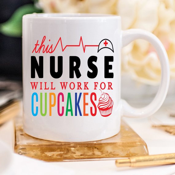 A high-quality ceramic coffee mug featuring the humorous text 'This Nurse Will Work For Cupcakes', perfect for nurses and coffee lovers.