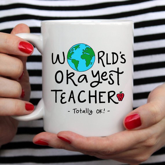 Funny Teacher Gift Mug featuring the 'World's Okayest Teacher' design, perfect for coffee lovers.