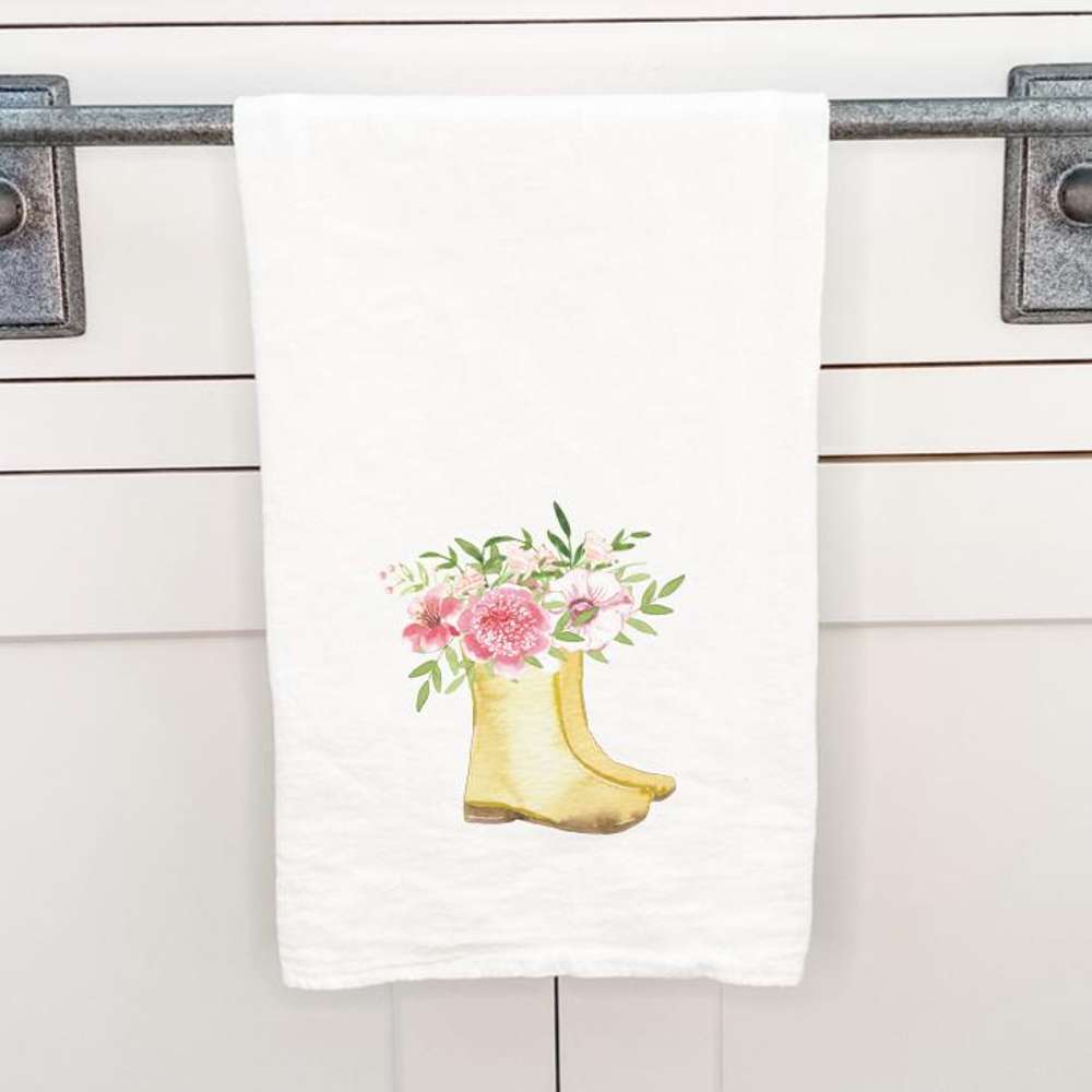 Garden Boots cotton tea towel featuring vibrant designs, made from 100% absorbent cotton, displayed on a kitchen countertop.