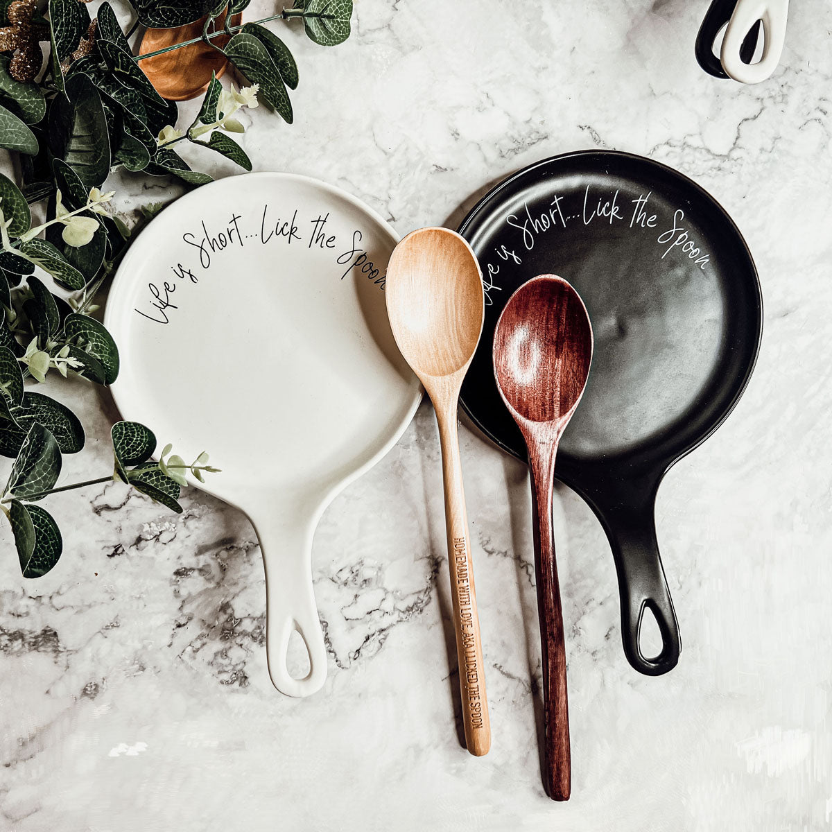 Give it a Rest LG NEW spoon rest and wooden spoon set featuring colorful designs and fun quotes, perfect for keeping kitchens clean.