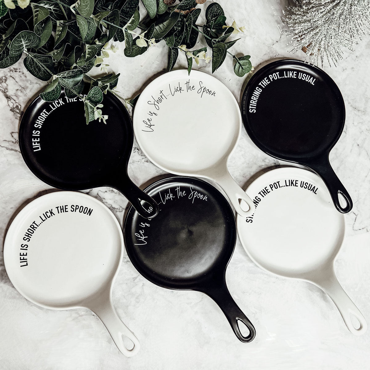 Give it a Rest LG NEW spoon rest and wooden spoon set featuring colorful designs and fun quotes, perfect for keeping kitchens clean.