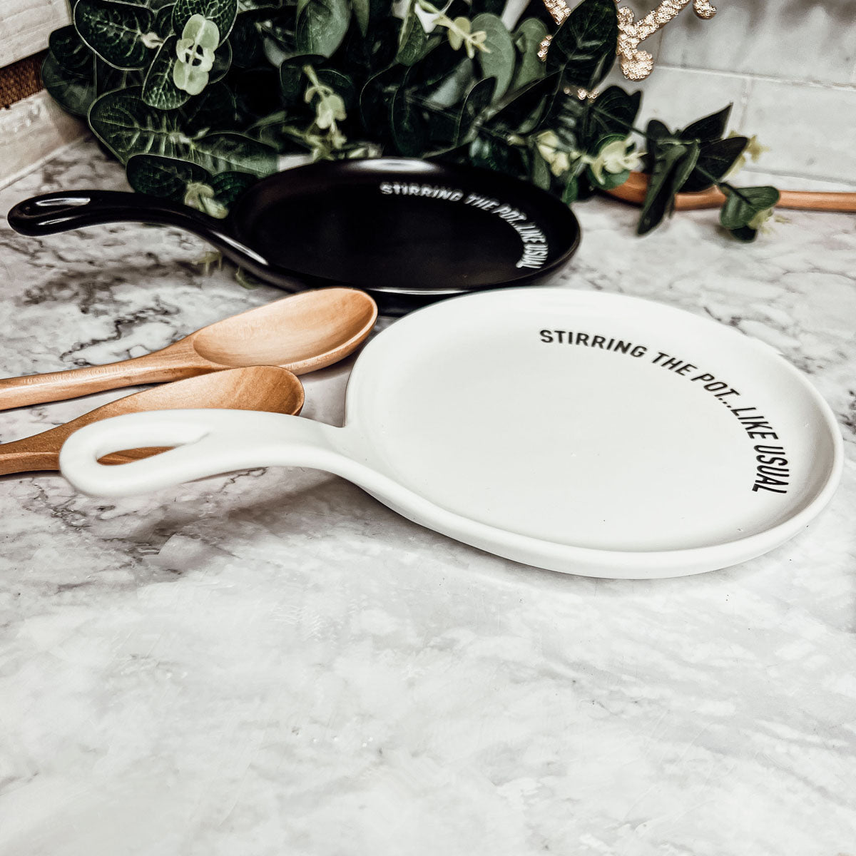 Give it a Rest LG NEW spoon rest and wooden spoon set featuring colorful designs and fun quotes, perfect for keeping kitchens clean.