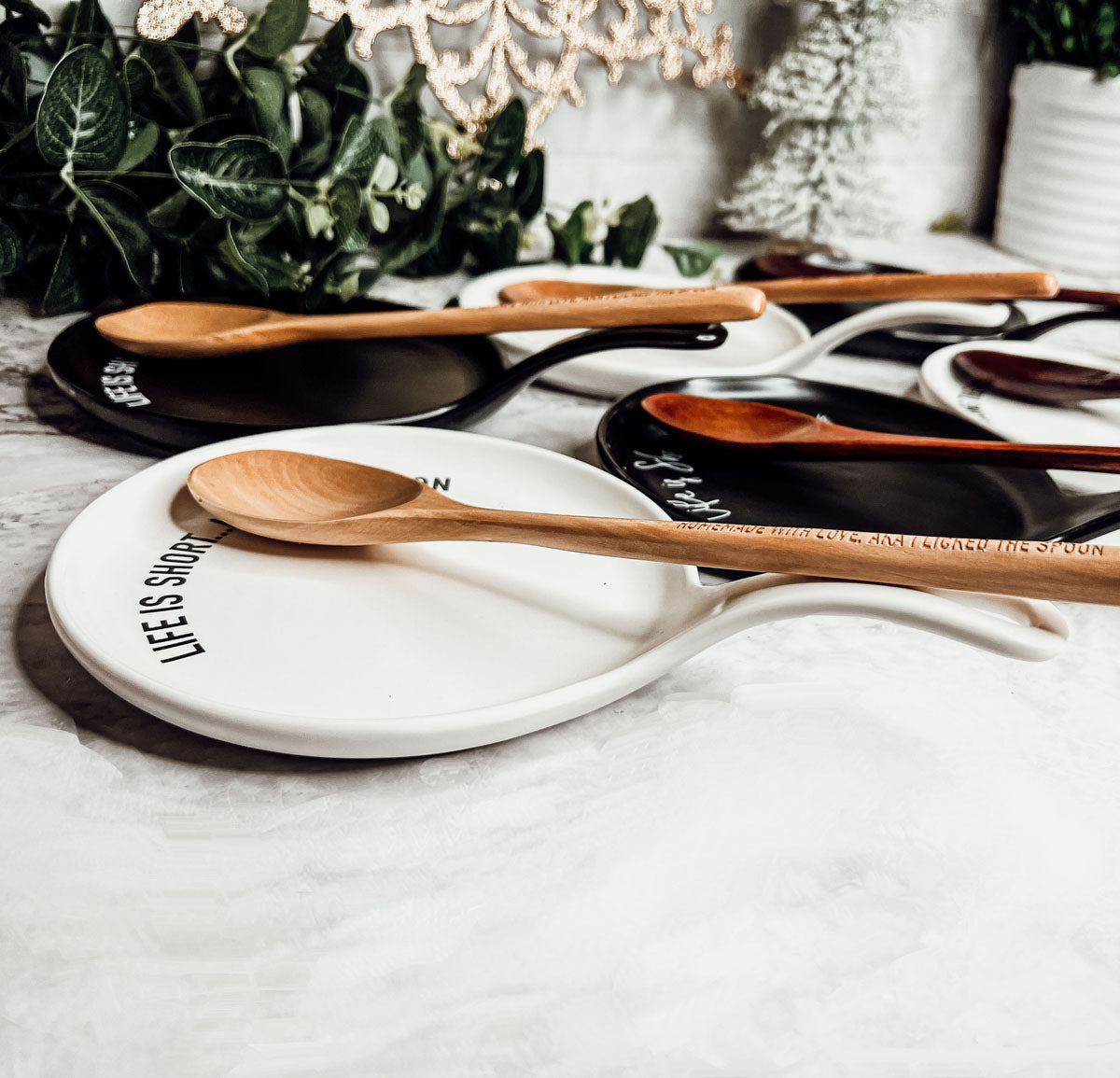 Give it a Rest LG NEW spoon rest and wooden spoon set featuring colorful designs and fun quotes, perfect for keeping kitchens clean.