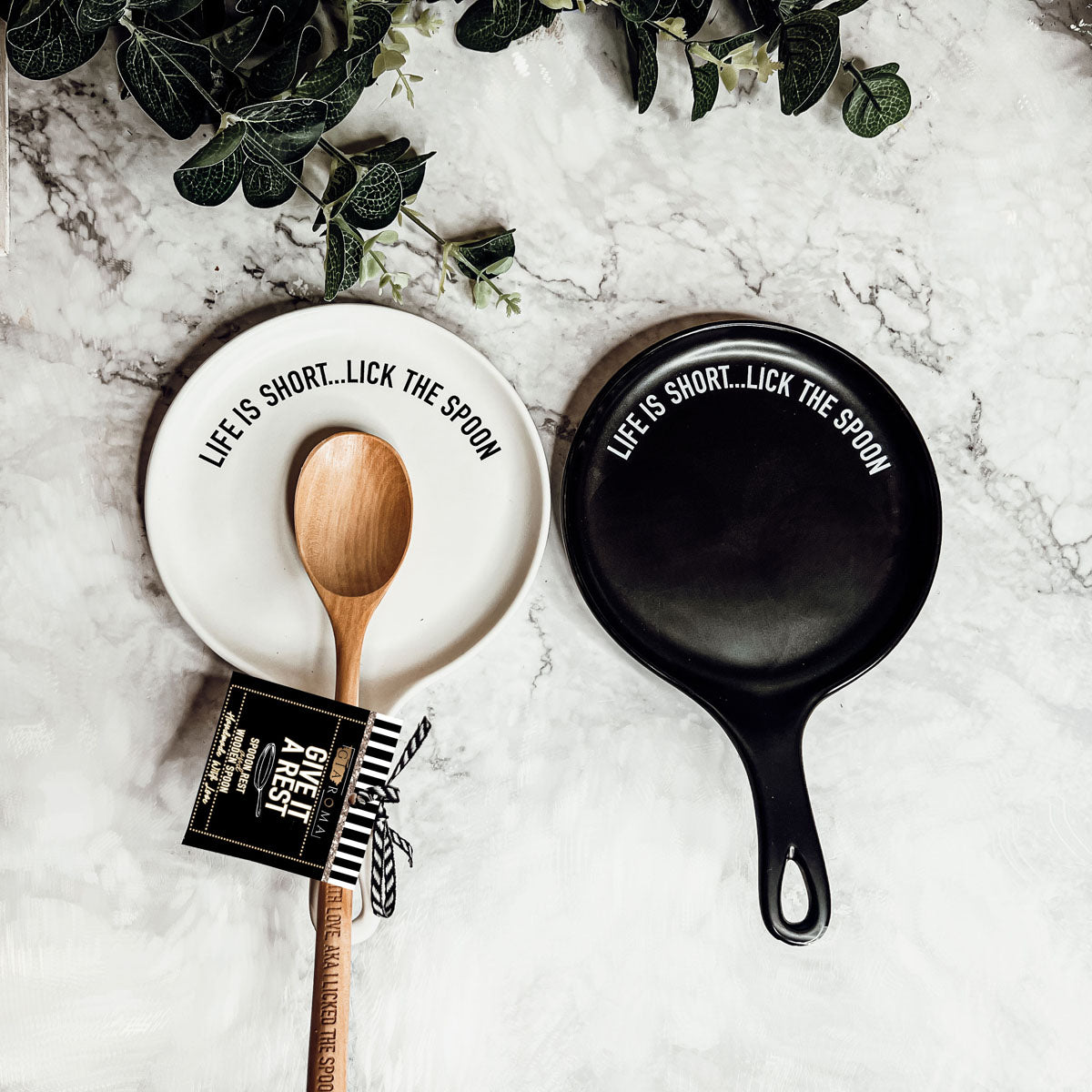 Give it a Rest LG NEW spoon rest and wooden spoon set featuring colorful designs and fun quotes, perfect for keeping kitchens clean.