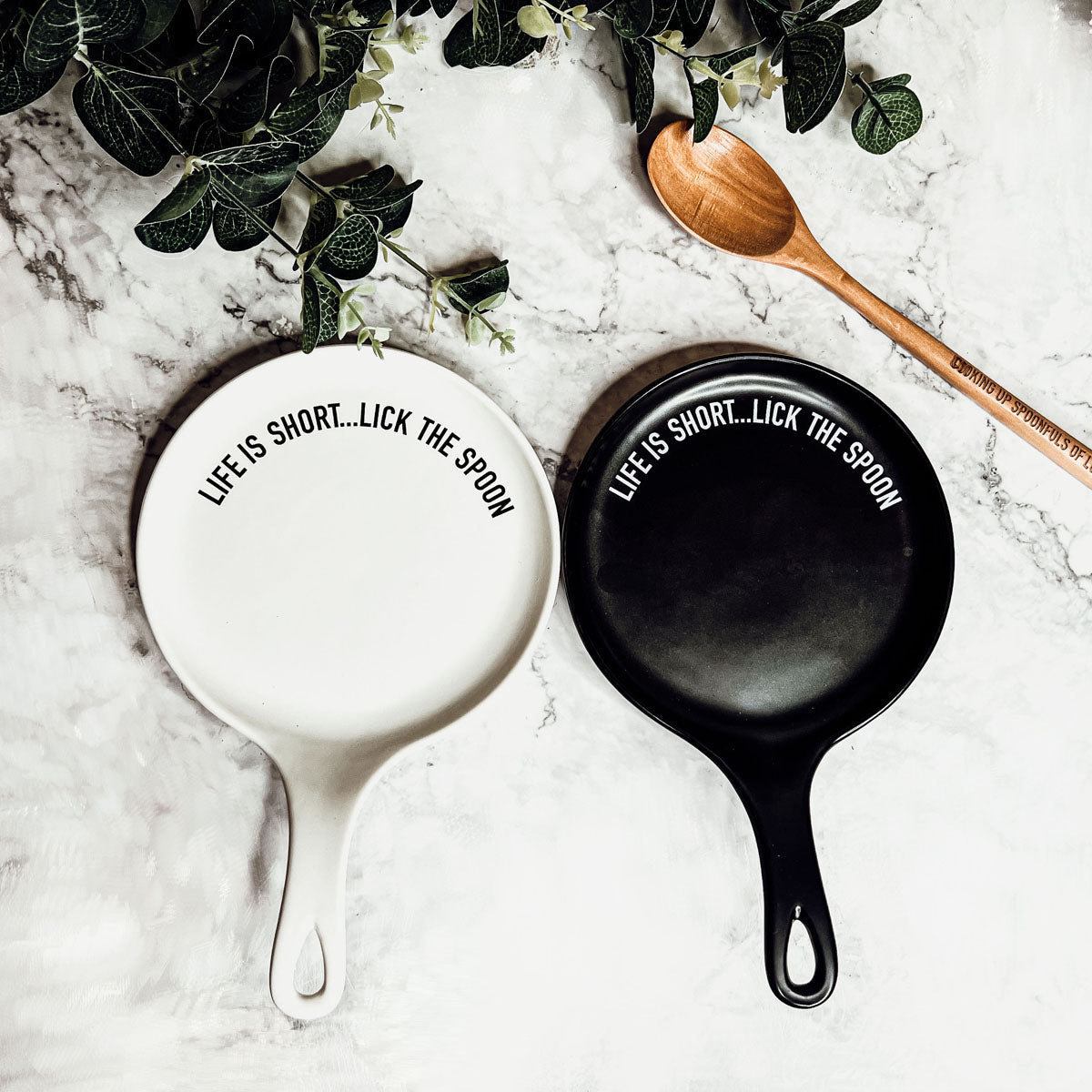 Give it a Rest LG NEW spoon rest and wooden spoon set featuring colorful designs and fun quotes, perfect for keeping kitchens clean.