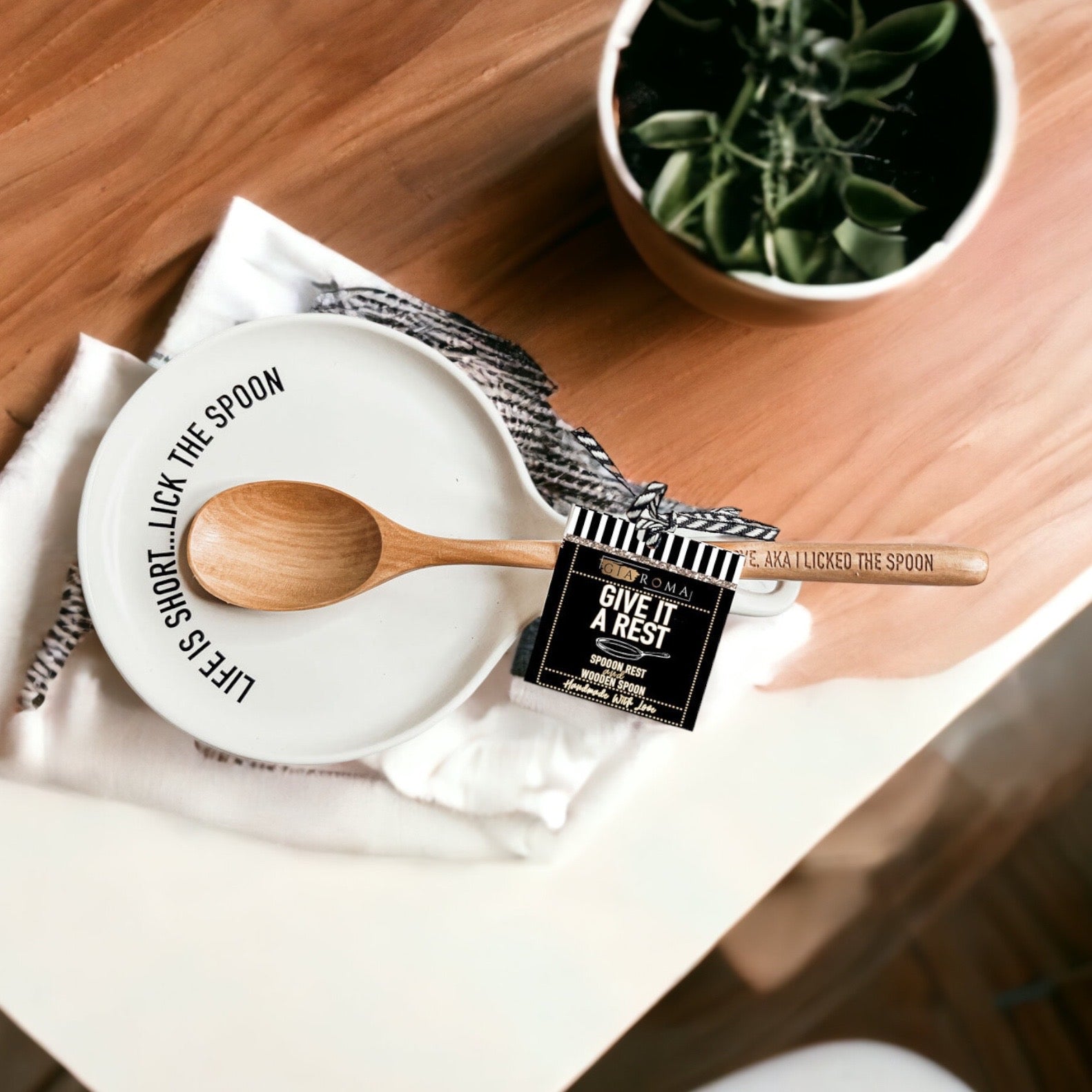 Give it a Rest LG NEW spoon rest and wooden spoon set featuring colorful designs and fun quotes, perfect for keeping kitchens clean.