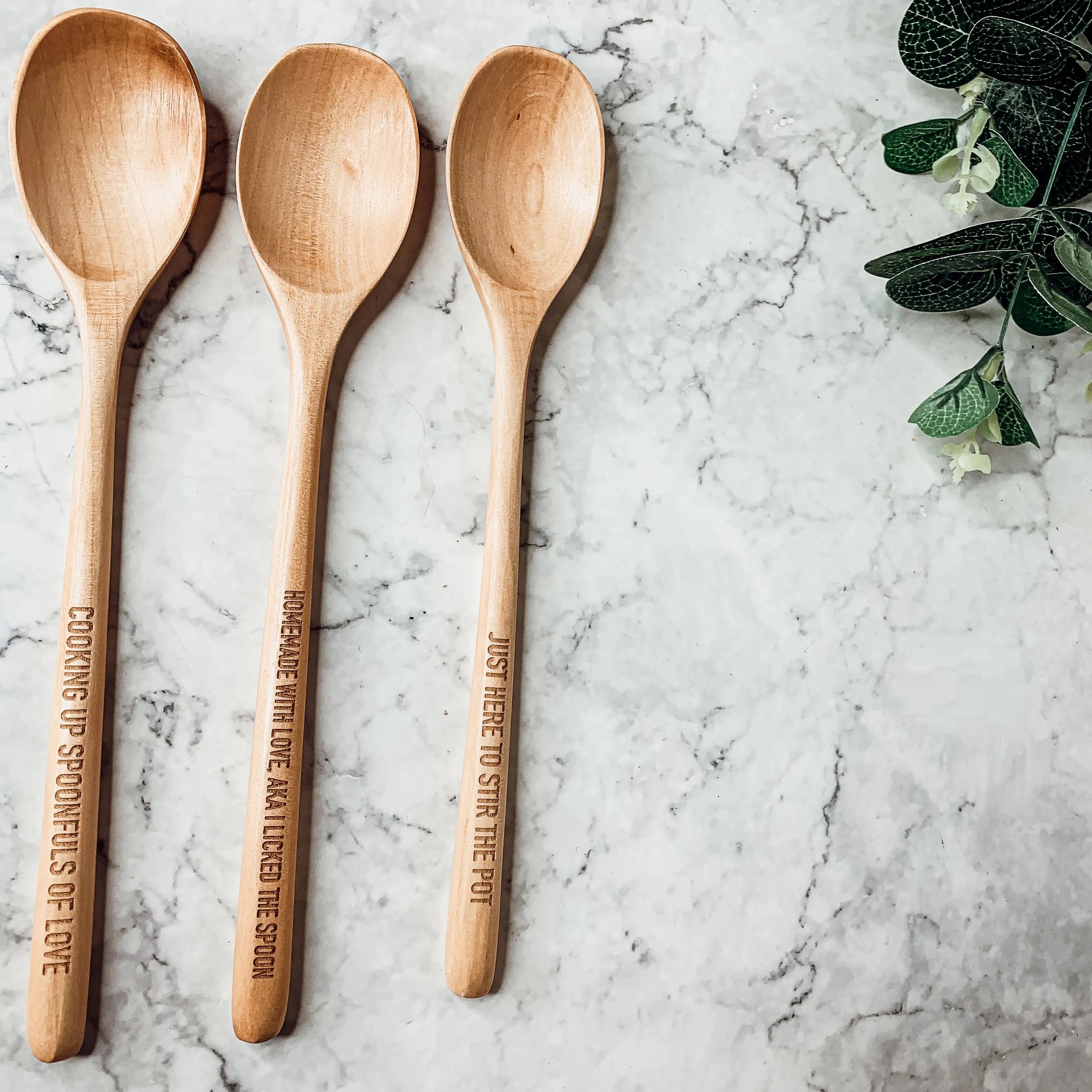 Give it a Rest LG NEW spoon rest and wooden spoon set featuring colorful designs and fun quotes, perfect for keeping kitchens clean.