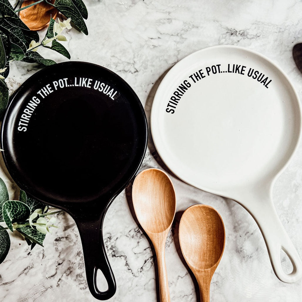 Give it a Rest LG spoon rest and wooden spoon set featuring various colors and fun quotes, perfect for keeping your kitchen clean.