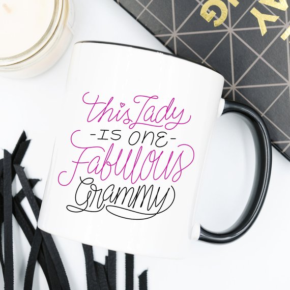 A humorous coffee mug featuring the phrase 'This Lady Is One Fabulous Grammy', designed for grandmothers, made of high-quality ceramic.