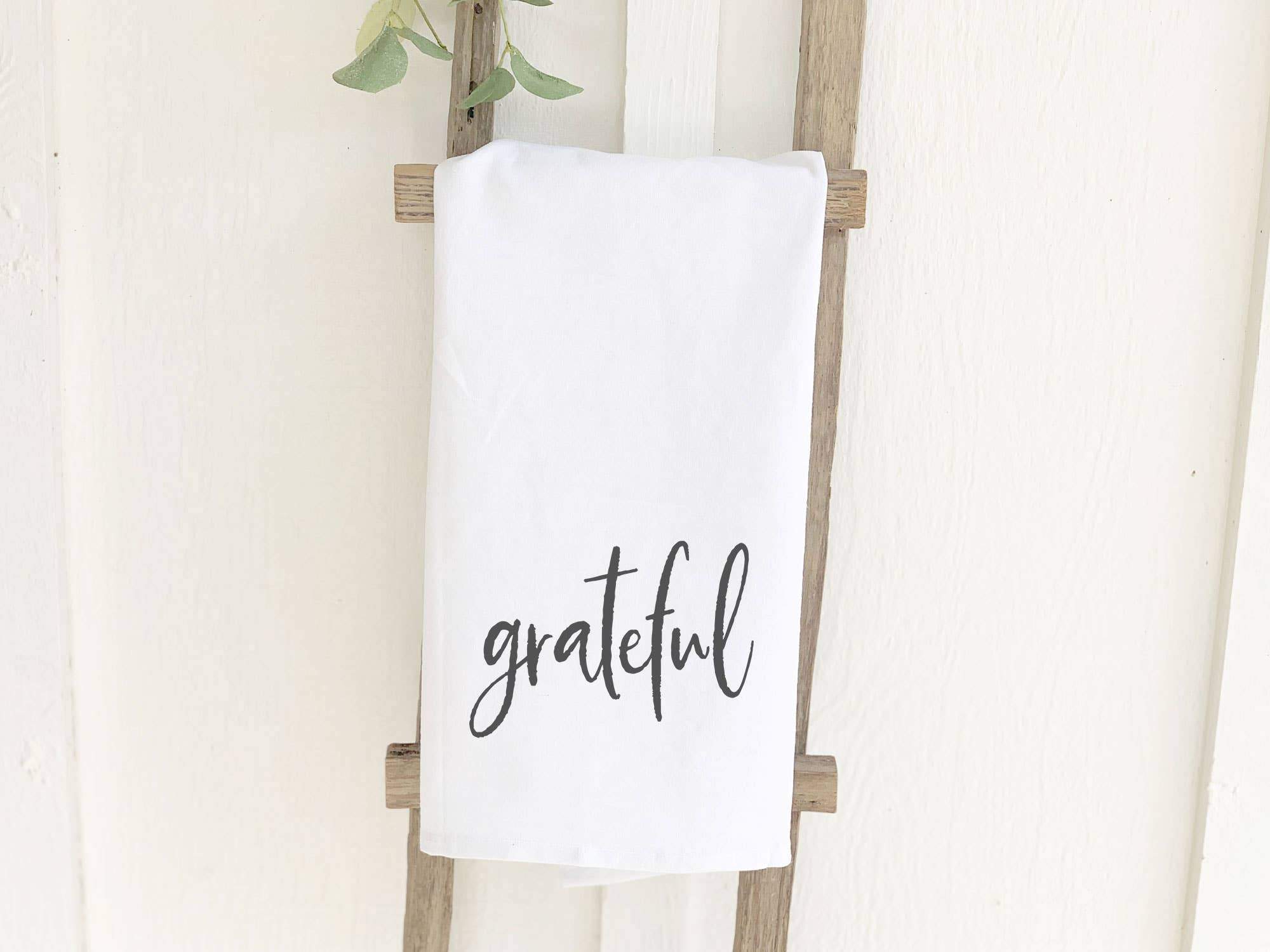 Grateful Cotton Tea Towel featuring vibrant colors and a beautiful design, perfect for kitchen use.