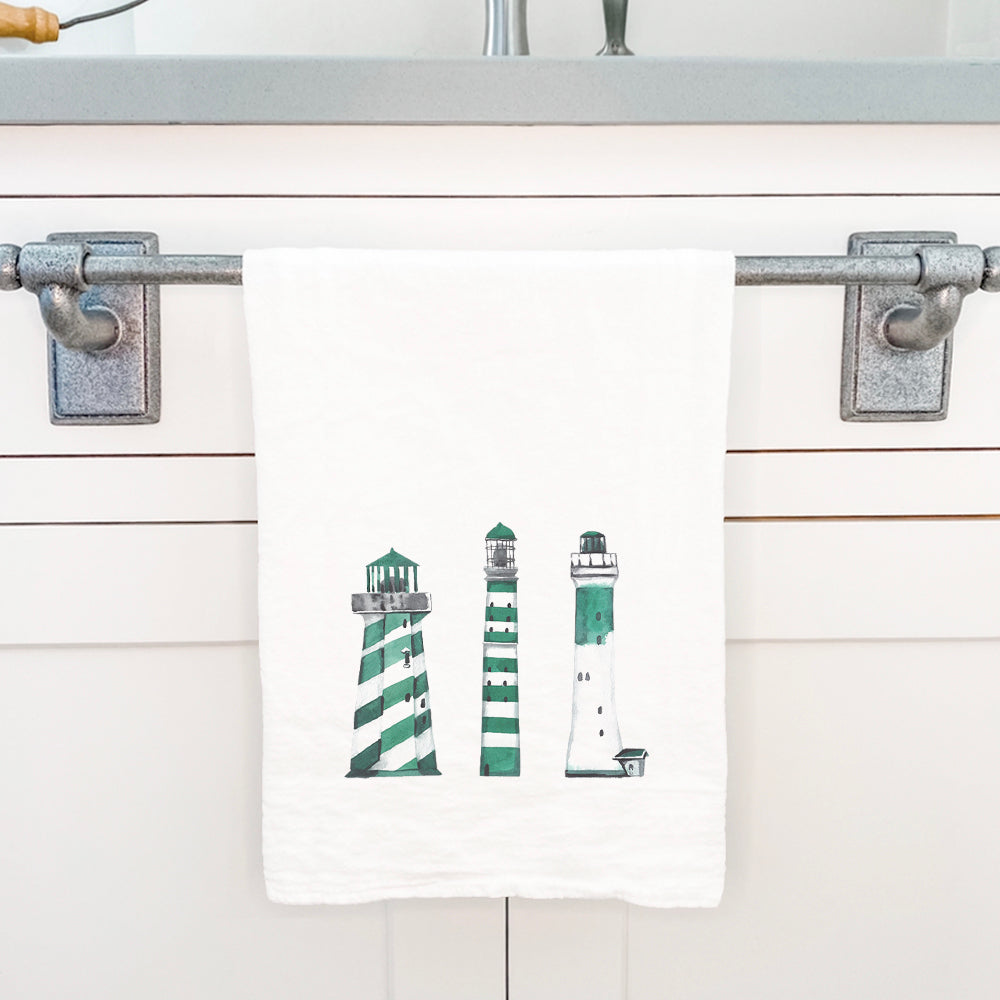 Green Lighthouses cotton tea towel featuring vibrant lighthouse designs, perfect for kitchen use.