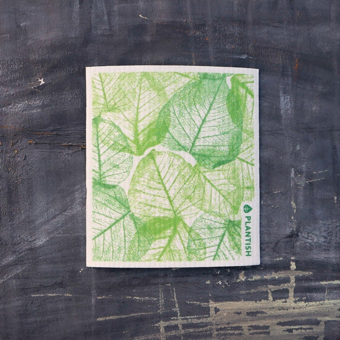 Green Vessel Swedish Sponge Cloth with leaf vein design, eco-friendly and absorbent, perfect for kitchen cleaning.