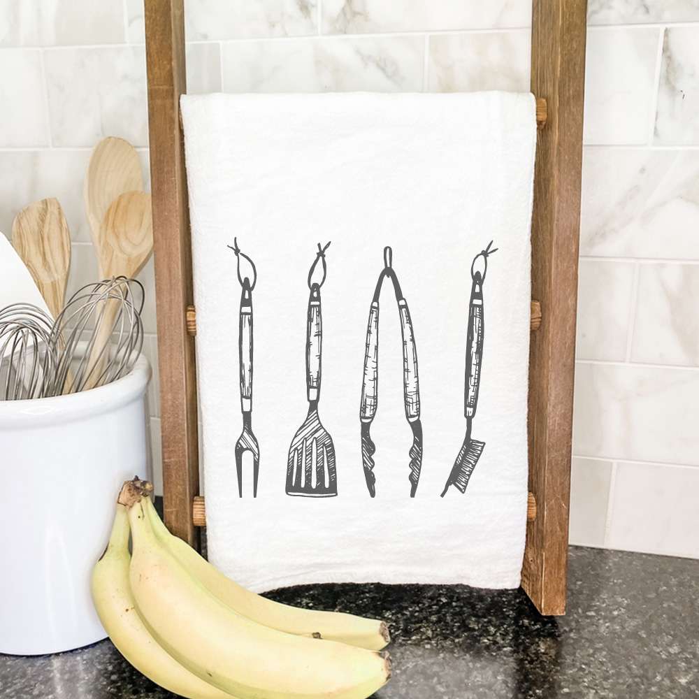 A vibrant cotton tea towel featuring a beautiful design, perfect for grilling and kitchen use, measuring 27 inches square.