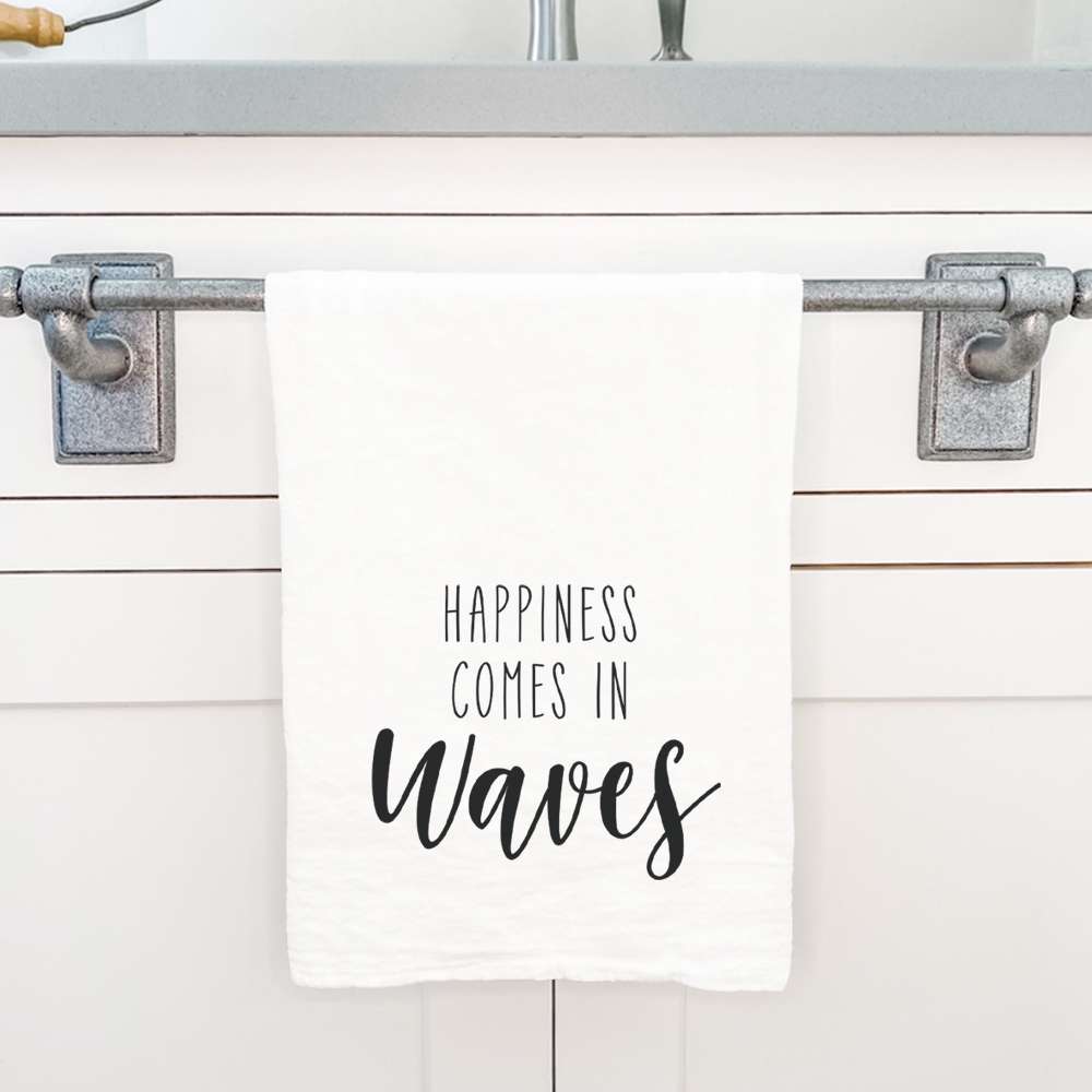 Happiness Comes in Waves cotton tea towel featuring vibrant water-based ink design, perfect for kitchen use and decor.