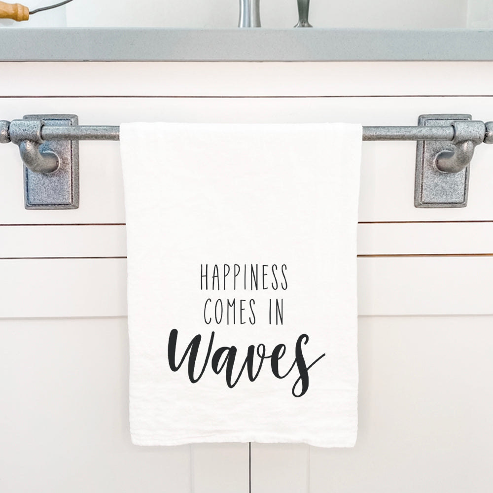 Happiness Comes in Waves cotton tea towel featuring vibrant water-based ink design, perfect for kitchen use and decor.